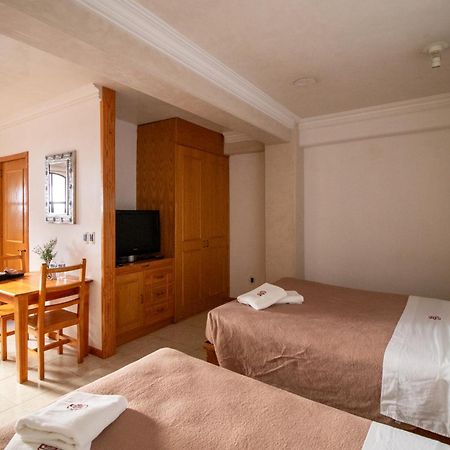 Suites Sevilla ปวยบลา ภายนอก รูปภาพ