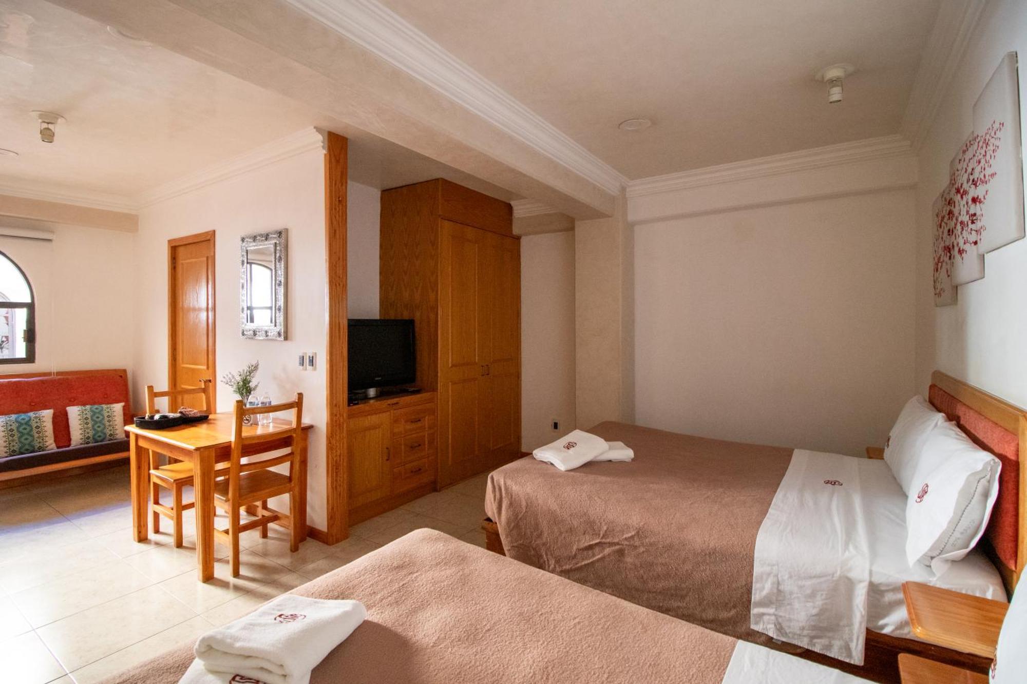 Suites Sevilla ปวยบลา ภายนอก รูปภาพ