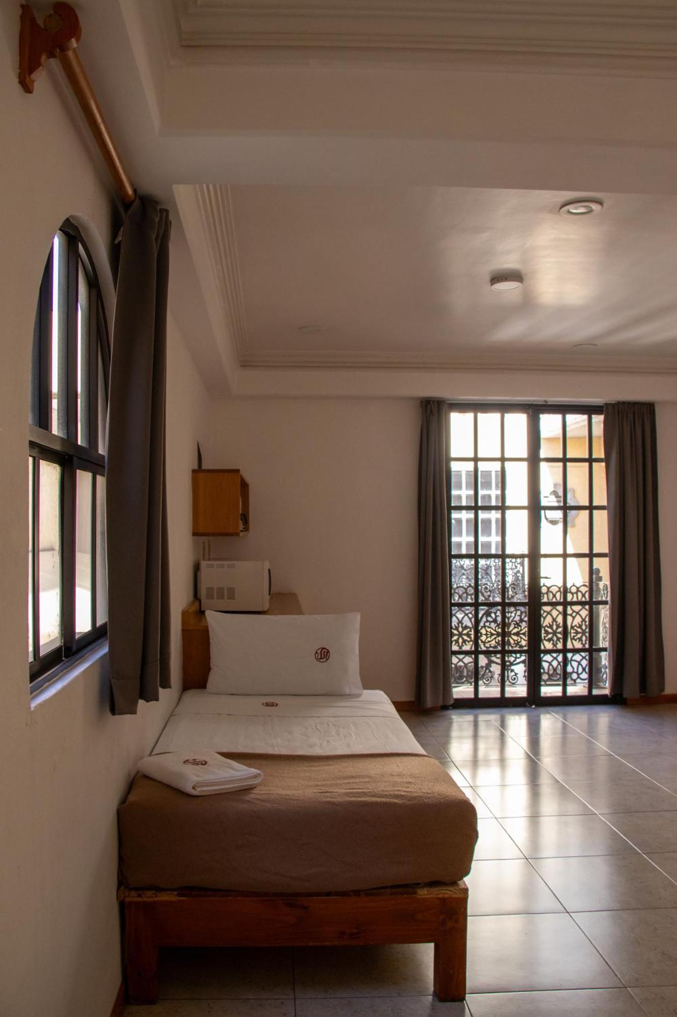 Suites Sevilla ปวยบลา ภายนอก รูปภาพ