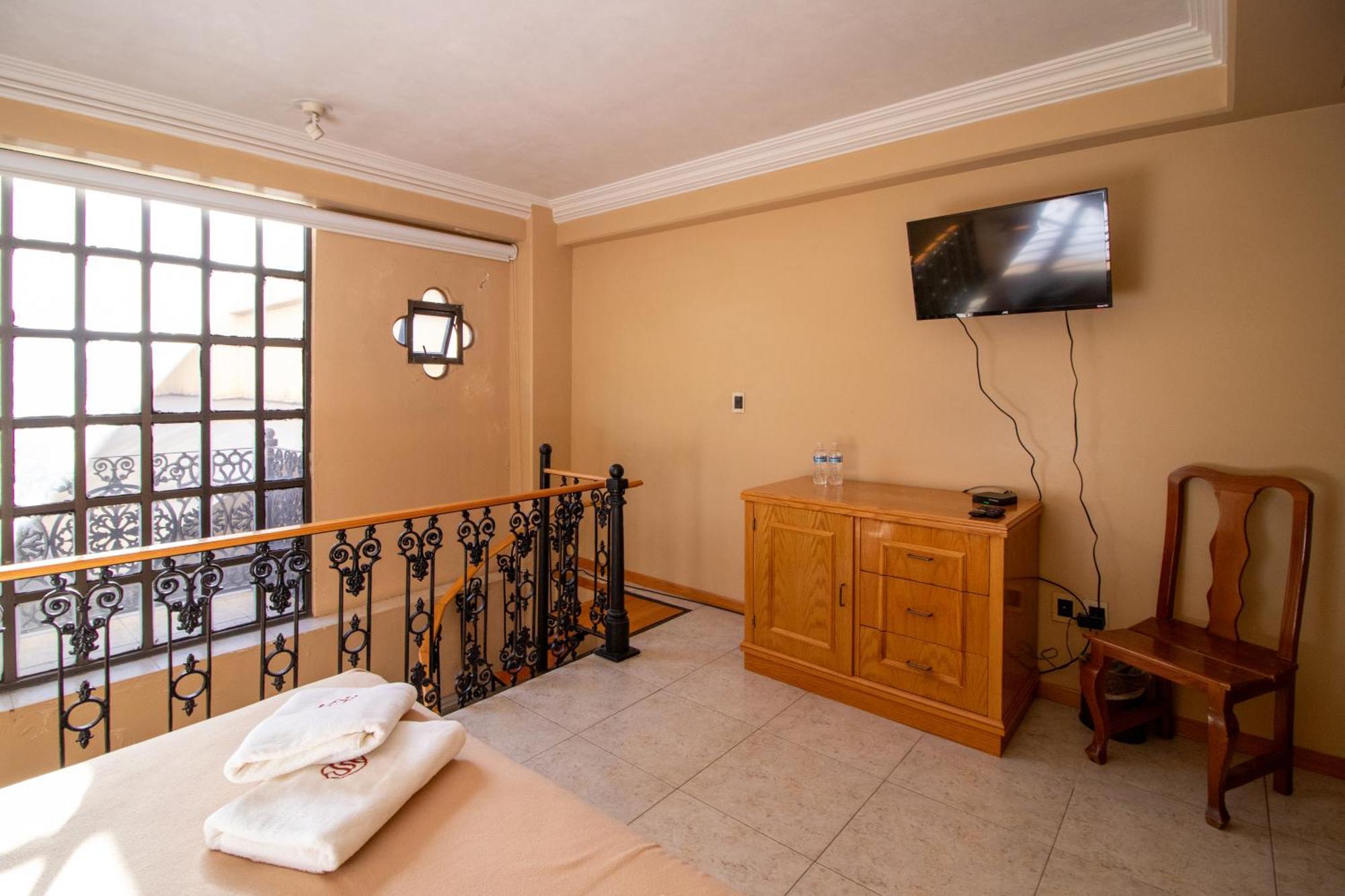 Suites Sevilla ปวยบลา ภายนอก รูปภาพ